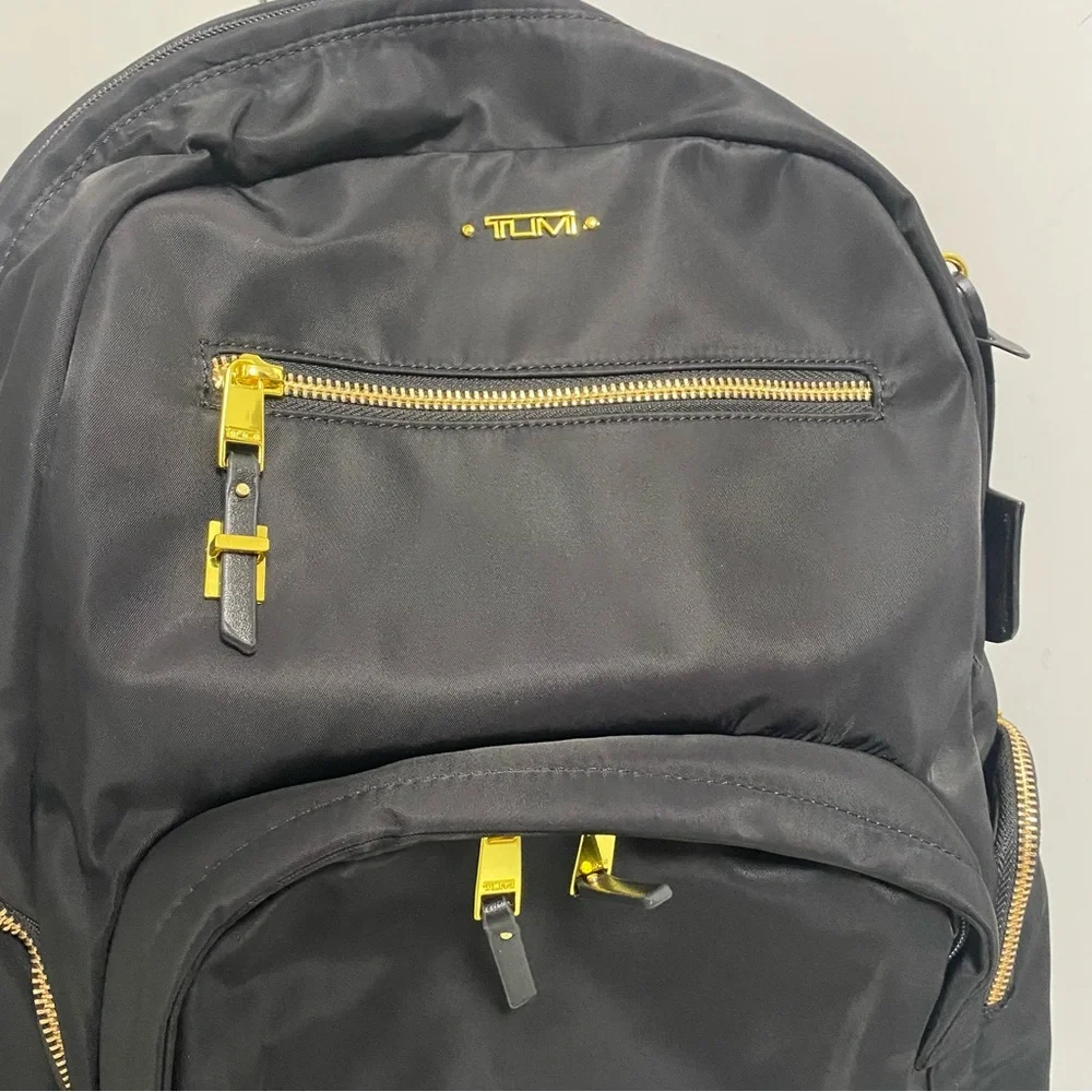 Tumi Black Backpack with Gold Zippers